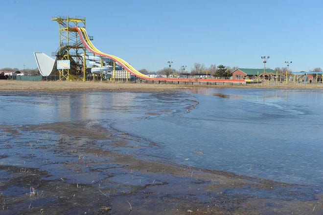 Michael Schumacher / AGN Media An ice cover lake has appeared off Interstate 40 near the Splash Water Park Thursday, Jan 2, 2014. Calls to the park were not returned to investigate the new ice skating rink.