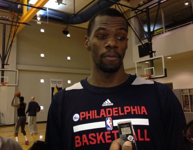 Rookie center Dewayne Dedmon, who signed a 10-day contract with the Sixers on Tuesday, answers a question after practice.