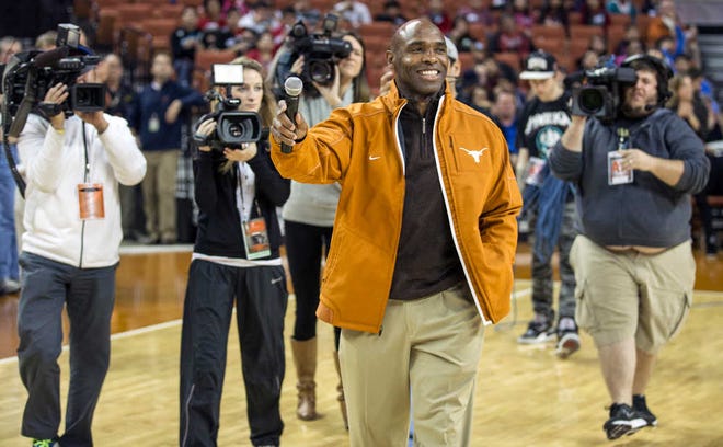 Texas new head football coach Charlie Strong speaks to fans during a timeout against Oklahoma in the first half of an NCAA college basketball game in Austin, Texas, Wednesday, Jan. 8, 2014. (AP Photo/Austin American- Statesman, Ricardo B. Brazziell) AUSTIN CHRONICLE OUT; COMMUNITY IMPACT OUT; INTERNET MUST CREDIT PHOTOGRAPHER AND STATESMAN.COM