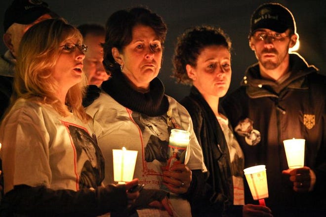 In 2010, friends and family members hold a candlelight vigil on the 21st anniversary of Jennifer Fay's disappearance. From left are Michelle Littlefield, an investigator and president of the Jennifer Lynn Fay Foundation; Dorothy MacLean, Jennifer's mother; Yvette Churchill, sister; and Jim Morrison, brother.