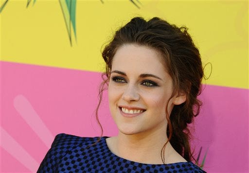 In this March 23, 2013 file photo, actress Kristen Stewart arrives at the 26th annual Nickelodeon's Kids' Choice Awards, in Los Angeles. Stewart has signed on to play the lead in Drake Doremus' futuristic love story "Equals," and it's making her a nervous wreck. "I can't believe I agreed to do it," said the actress during a recent phone interview of the sci-fi drama, also starring "X-Men: Days of Future Past" star Nicholas Hoult. (Photo by Jordan Strauss/Invision/AP, File)