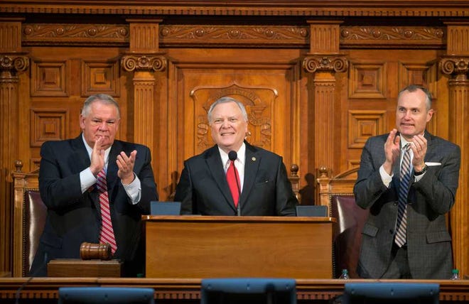 Georgia Gov. Nathan Deal delivers his State of the State address at the Capitol as House Speaker David Ralston, left, and Lt. Gov. Casey Cagle, look on, Wednesday, Jan. 15, 2014, in Atlanta. Gov. Deal says he will propose a $547 million increase in state education spending, calling it the "largest single year increase in K-12 spending in seven years." (AP Photo/David Goldman)