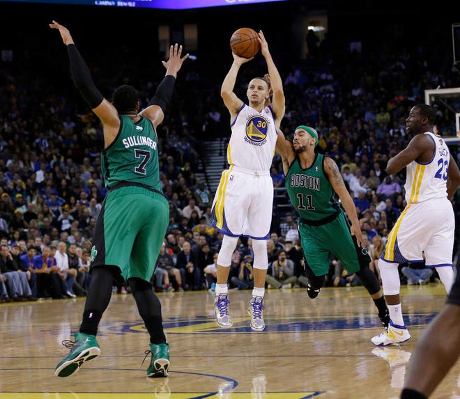 Golden State Warriors' Stephen Curry (30) makes a three-point basket over Boston Celtics' Jared Sullinger (7) and Jerryd Bayless (11) during the second half of an NBA basketball game on Friday, Jan. 10, 2014, in Oakland, Calif. Golden State won 99-97. (AP Photo/Marcio Jose Sanchez)