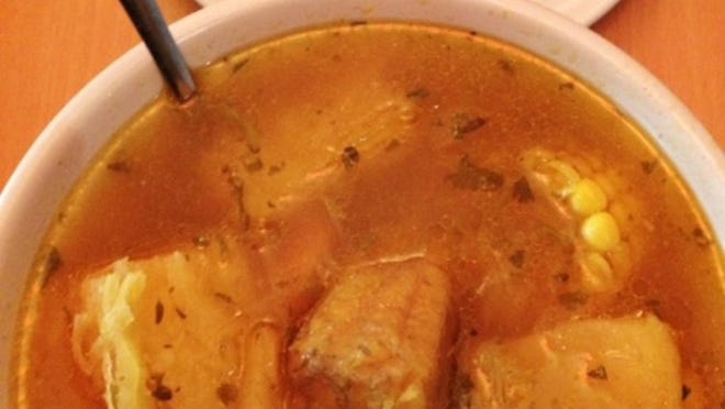 A bowl of Dominican-style sancocho stew, stocked with meat, yuca and other root vegetables, is served at Don Café in West Palm Beach. (Photo by Liz Balmaseda)