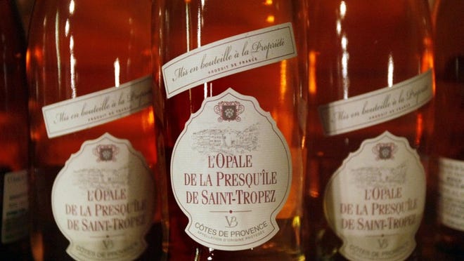 L’Opale de la Presqu’île de Saint-Tropez rosé from the Côtes de Provence in southern France. Wine tasting at The French Wine Merchant on Palm Beach on Friday evening, January 3, 2014. (J. Gwendolynne Berry/The Palm Beach Post)