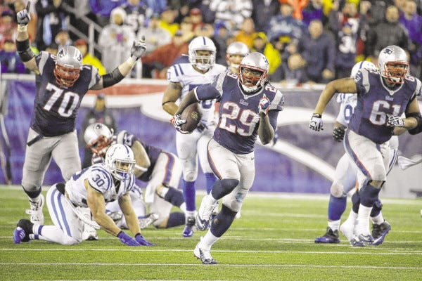 New England Patriots running back LeGarrette Blount (29) heads downfield for a touchdown during the second half of an AFC divisional NFL playoff football game against the Indianapolis Colts in Foxboro Saturday.