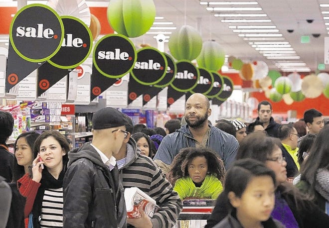 November and December account for 20 percent of the retail industry’s sales, so a lot is at stake for stores. Shoppers on Thanksgiving crowd the aisles of a Target store in Colma, Calif.