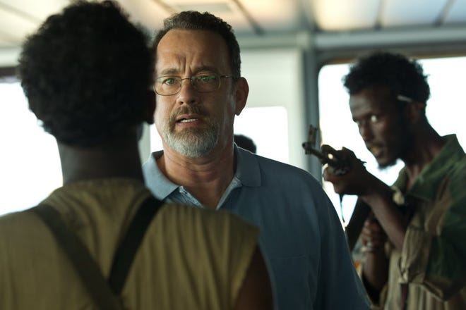 This film image released by Sony - Columbia Pictures shows Tom Hanks, center, in a scene from "Captain Phillips" about the 2009 hijacking of the cargo ship Maersk Alabama. Hanks plays Capt. Richard Phillips, a 1979 academy graduate of Massachusetts Maritime Academy in Buzzards Bay, Mass.