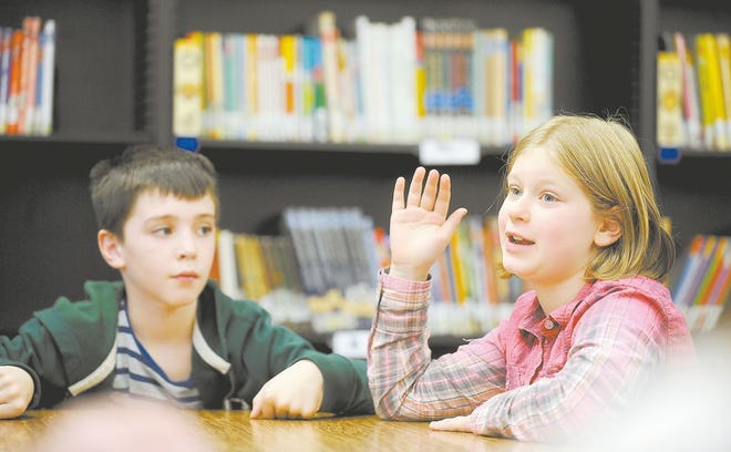 Malaki Weaver, 9, and Chloe Hamric, 8, third graders at Watson Elementary School in Perry Township, answer questions during a focus group about efforts to prevent bullying at the school. Hamric said she now knows she should first tell a bully to stop his or her bad behavior before running to tell an adult.