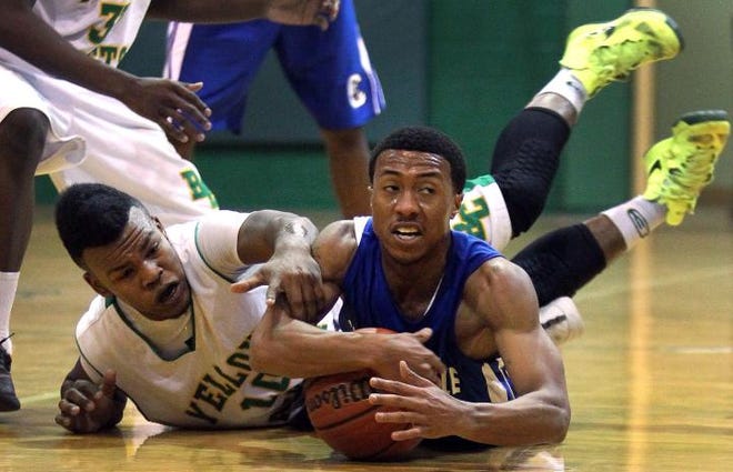 Bessemer City’s Jha’Qui Adams, left, and Cherryville’s Jamar Wright dive after a loose ball during their game Friday night.