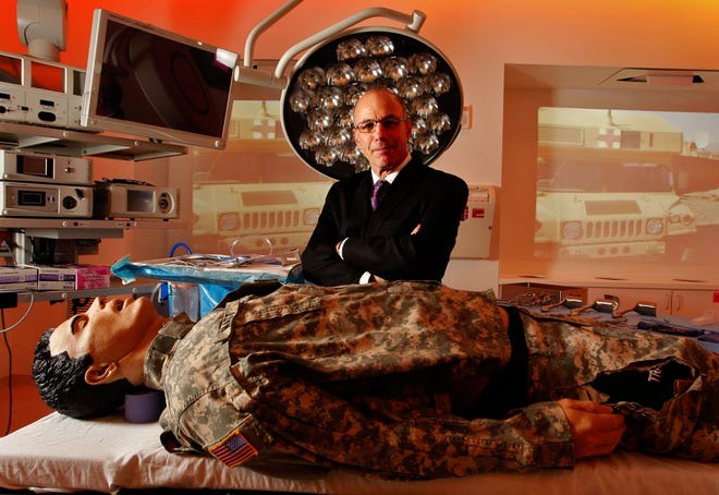 CAMLS IS THE LEGACY of Dr. Stephen Klasko, the former CEO of USF Health and dean of the Morsani College of Medicine, seen here with a mannequin in the lab’s trauma operating room. (DANIEL WALLACE | TaMPa Bay TIMES (2012))