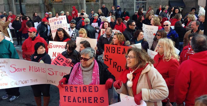 Members of the New Bedford Educaters Association and their supporters held a rally at City Hall Friday afternoon.