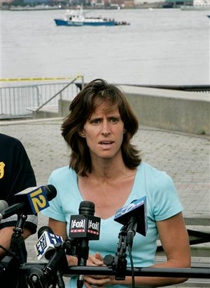 In this Saturday, Aug. 8, 2009 file photograph, Hoboken Mayor, Dawn Zimmer speaks to the media as she stands near the Hudson River in Hoboken, N.J. Zimmer, mayor of a New Jersey city that sustained severe flooding from Hurricane Sandy claims the Christie administration withheld millions of dollars in recovery grants because she refused to sign off on a politically connected development. MSNBC first reported her comments Saturday. (AP Photo/Mel Evans,file)