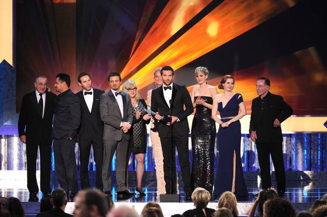 From left, Robert De Niro, Michael Pena, Alessandro Nivola, Jeremy Renner, Colleen Camp, Elisabeth Rohm, Bradley Cooper, Jennifer Lawrence, Amy Adams and Paul Herman accept the award for outstanding performance by a cast in a motion picture for “American Hustle” at the 20th annual Screen Actors Guild Awards at the Shrine Auditorium on Saturday, Jan. 18, 2014, in Los Angeles. (Photo by Frank Micelotta/Invision/AP)