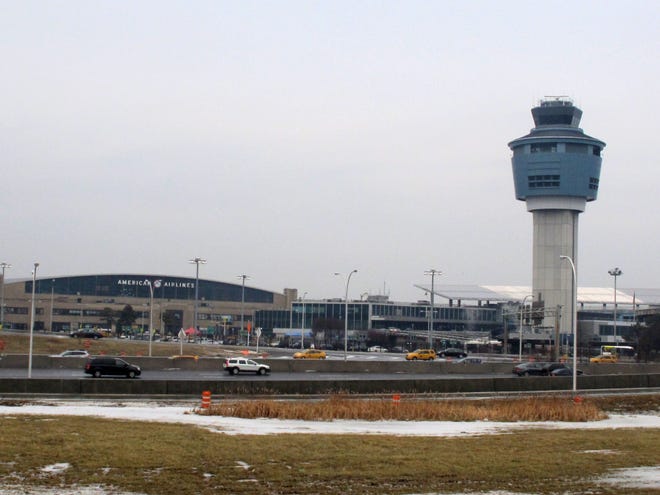 In this Jan. 10, 2014, photo, the control tower and hangars at New York's LaGuardia Airport are shown. Dark, dingy, cramped and sad are some of the ways travelers describe LaGuardia Airport, a bustling hub often ranked in customer satisfaction surveys as the worst in America.