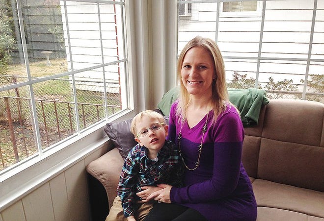Sarah Bergstrom poses for a photo with her son Blake, 4, Friday in her home in Charleston, W.Va. The 29-year-old nurse who is 4 months pregnant with her second child was devastated when she learned after a ban on tap water was lifted days after a chemical leak that health officials urged pregnant women not to drink tap water until the chemical is entirely undetectable. AP PHOTO/JOHN RABY