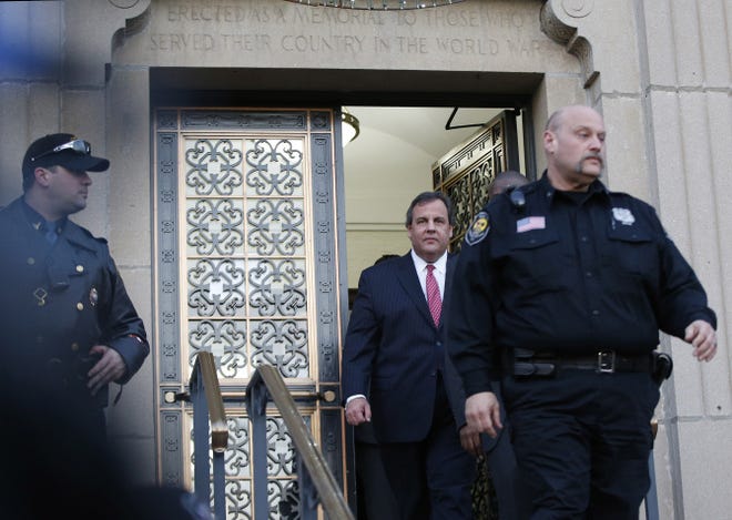 New Jersey Gov. Chris Christie walks out after a visit City Hall Thursday, Jan. 9, 2014, in Fort Lee, N.J. Christie traveled to Fort Lee to apologize in person to Mayor Mark Sokolich.