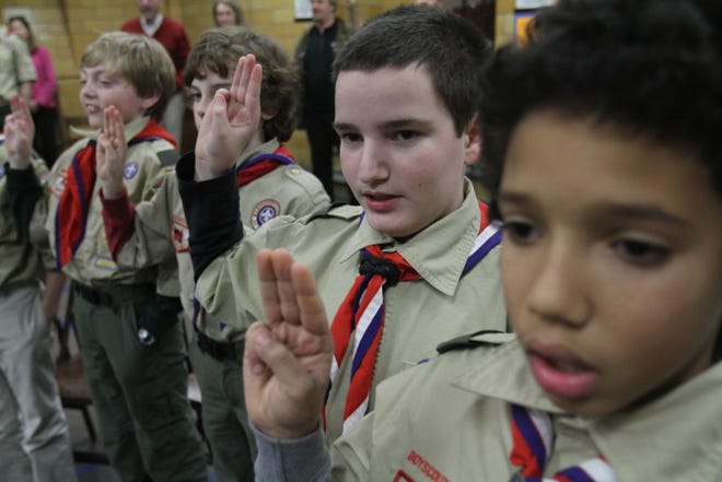 Boy Scouts from Troop 28 recite their pledge during a January meeting at Central Congregational Church in Providence. The troop has stood up for the rights of gay Scouts and Scoutmasters.