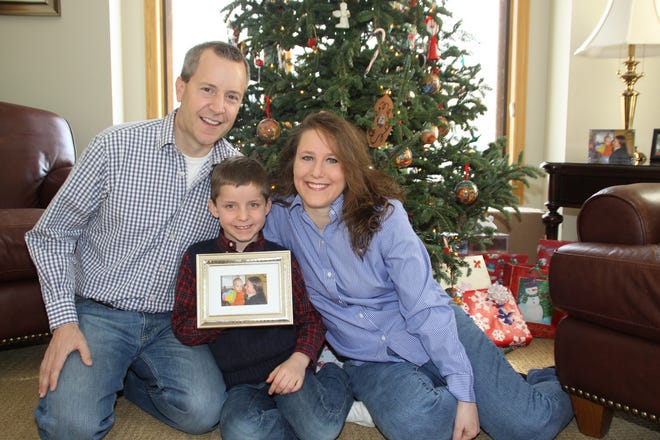 John, Jack and Renee Thomas pose at their home in Minnetrista, Minn. Jack, 
from Russia, was adopted in 2008. When a Russian ban on adoptions by 
Americans was imposed in 2013, the family was trying to adopt Jack's 
biological brother, Nikolai.2012 FAMILY PHOTO