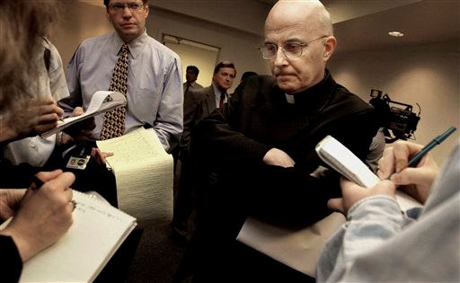 FILE - This April 17, 2002 file photo shows Chicago Cardinal Francis George listening to reporters' questions before he left for Rome to meet with Vatican officials and other American cardinals about the child sex abuse scandals in the United States. Attorneys for sex abuse victims will post thousands of documents to a website Tuesday morning, Jan. 21, 2014, after receiving them from the Archdiocese of Chicago last week as part of legal settlements. Attorneys say the documents will show that the archdiocese concealed the abuse for decades. George says the disclosures are an attempt at transparency and to help victims heal. He's also apologized to victims and area Catholics for the abuse. (AP Photo/M. Spencer Green, File)