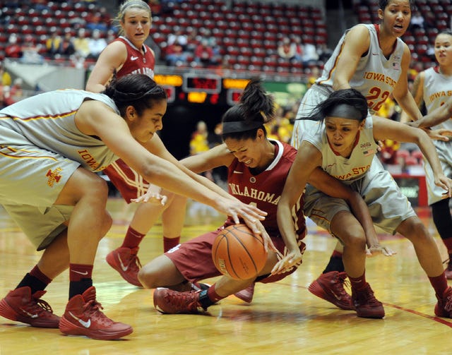 Iowa State's Tenisha Matlock, left, and Seanna Johnson, right, try to grab the ball from Oklahoma's Nicole Griffin on Tuesday. Photo by Nirmalendu Majumdar/Ames Tribune 
 Iowa State's Jadda Buckley shoots over Oklahoma's Nicole Griffin and Sharane Campbell on Tuesday. The Cyclones lost 75-54. Photo by Nirmalendu Majumdar/Ames Tribune.


 
 Iowa State's Nikki Moody drives past Oklahoma's Nicole Griffin and Gioya Carter during a 75-54 loss on Tuesday. Photo by Nirmalendu Majumdar/Ames Tribune