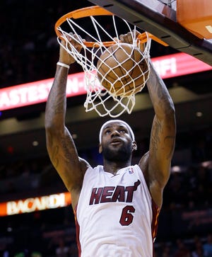 Heat forward LeBron James throws down a dunk during Miami's 93-86 win over the Celtics on Tuesay night.