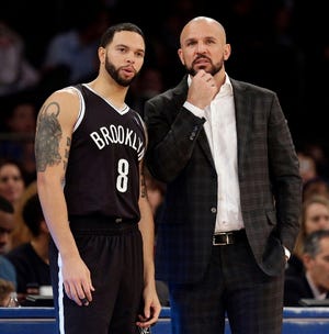 Brooklyn Nets' head coach Jason Kidd, right, talks with Deron Williams during the first half of the NBA basketball game at Madison Square Garden, Monday, Jan. 20, 2014, in New York.