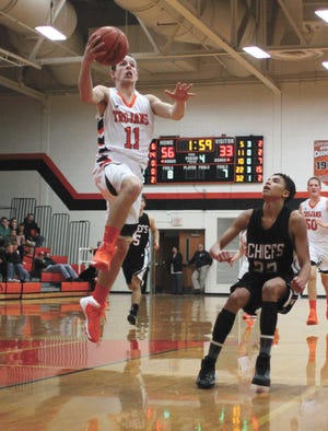 Jacob Cline of Sturgis soars in for a layup Tuesday night against White Pigeon.