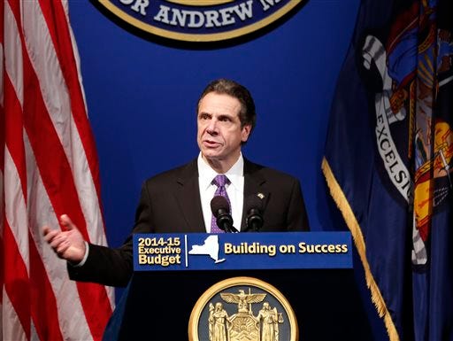 New York Gov. Andrew Cuomo presents his 2014-15 executive budget proposal at the Hart Theatre on Tuesday, Jan. 21, 2014, in Albany, N.Y.