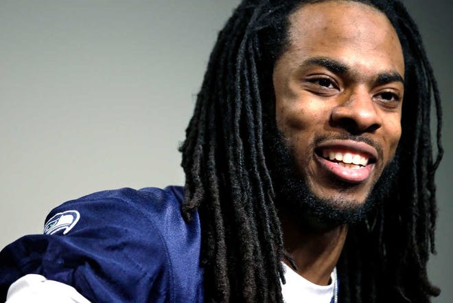 Seattle Seahawks' Richard Sherman speaks during a news conference Wednesday, Jan. 22, 2014, in Renton, Wash. The Seahawks play the Denver Broncos in the NFL football Super Bowl on Feb. 2. (AP Photo/Elaine Thompson)
