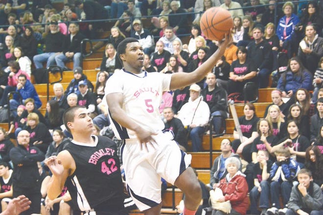 Ray'nell Anderson of Sault High drives past Brimley's Tommy Aikens during Tuesday's game.