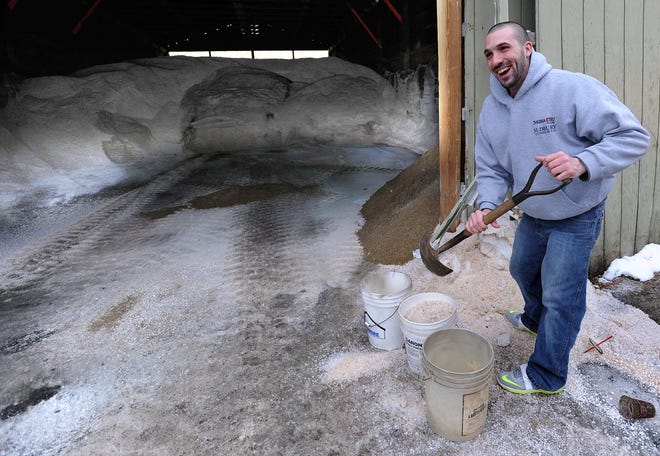 Christopher Collins of Ashland fills up three buckets at the Ashland DPW salt shed for his grandmother, Joan Collins (off camera).

Daily News Staff Photo / Allan Jung