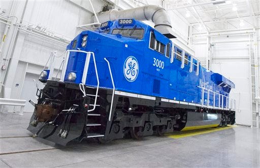 This photo from Sept. 14, 2013, which was provided by General Electric, shows an experimental natural gas locomotive in Erie, Pennsylvania. The diesel locomotives that became freight railroadsâ?? workhorse after World War II could be replaced in the next few years by units like this that burn a mix of natural gas and diesel. The switch could likely reduce fuel costs and pollution significantly while allowing railroads to take advantage of abundant domestic supplies of natural gas. But many questions about using natural gas locomotives remain unanswered, and those could easily derail the idea. (AP Photo/General Electric, Mark Fainstein)