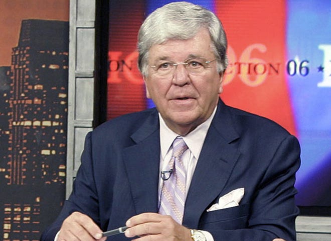 New England Cable News anchor Chet Curtis waits on the set before a 2006 political debate.