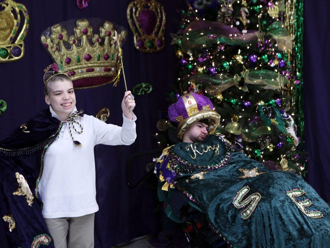 The School for Exceptional Children named Cameron Trosclair (right), 17, and Jordan Ardoin, 16, as their 2014 Mardi Gras king and queen Friday at the school in Houma.