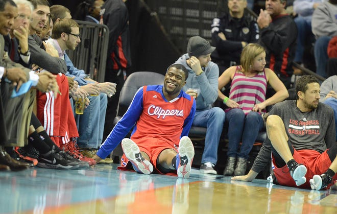 Los Angeles Clippers rookie Reggie Bullock watches his teammates compete against the Charlotte Bobcats on Wednesday in the third quarter at Time Warner Cable Arena.