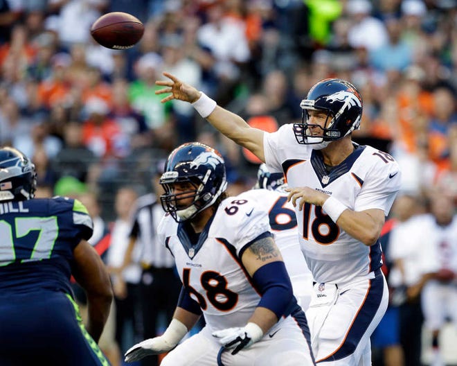 ADVANCE FOR WEEKEND EDITIONS, JAN. 25-26 - FILE - In this Aug. 17, 2013, file photo, Denver Broncos quarterback Peyton Manning (18) passes as Zane Beadles (68) blocks in the first half of a preseason NFL football game against the Seattle Seahawks in Seattle. The two teams are slated to meet in Super Bowl XLVIII on Sunday, Feb. 2, 2014, in East Rutherford, N.J. (AP Photo/Elaine Thompson, File)