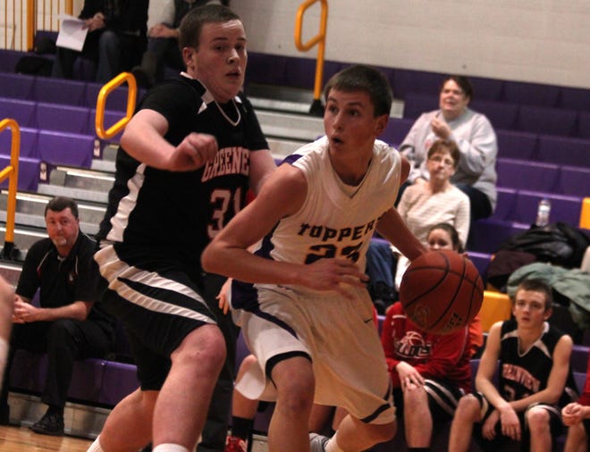 Senior guard Jordan Luczaj (right) drives against Greenview in a home conference game for Mount Pulaski. Photo by Bill Welt/The Courier