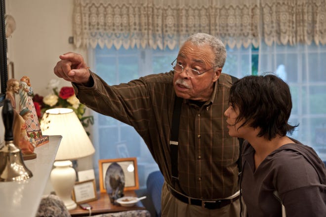 Vanessa Hudgens, right, stars as pregnant and homeless Apple Bailey and James Earl Jones is Father Frank McCarthy in "Gimme Shelter."