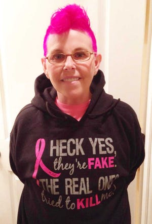 CONTRIBUTED St. Augustine resident Pam Cowell held a "Hair Raising/Razing" event to collect hair for Locks of Love and have her hair colored bright pink and cut into a mohawk before her breast cancer treatments began.