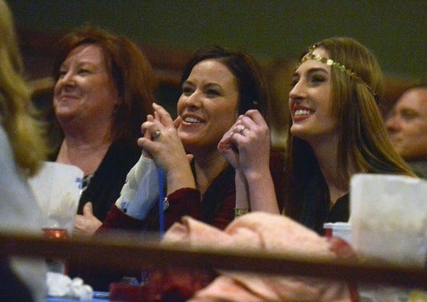 Ali Henderson, right, watches a clip of herself on ‘American Idol’ with her grandmother, Patricia Reavis, left, and mother, Stephanie Henderson on Thursday at Capri Theatre in Gaffney. (Halifax Media Services)