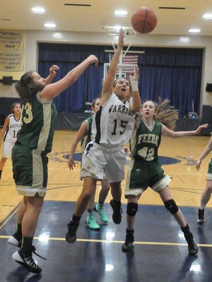 Coyle-Cassidy's Steph Skiba takes a shot in the lane against Bishop Feehan's Marissa Fontaine, left, and Emily Miccile in Friday's Eastern Athletic Conference game at Coyle-Cassidy High School.