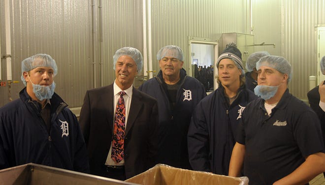 Kyle Lorenz of Hudsonville, right, describes the ice cream making process at Hudsonville Ice Cream to Detroit Tigers, from right, Andy Dirks, Coach Jeff Jones, Tigers CEO and General Manager Dave Dombrowski and Bryan Holaday on Friday morning. Dennis R.J. Geppert/Sentinel Staff
