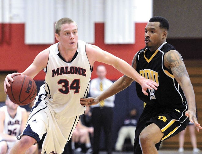 Malone’s Cory Veldhuizen drives past Ohio Dominican’s Brandon Carr on Saturday in Canton. The Pioneers won 84-74.