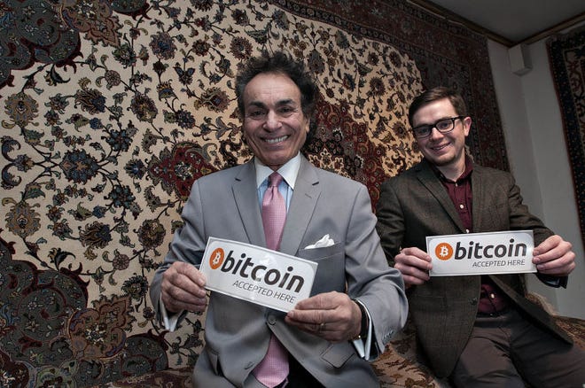 Ali Nejad, President of Nejad Gallery (left) and Michael DeLeo, Asst. CEO of Nejad Gallery has become the first local merchant (that we know of) to accept the virtual currency Bitcoin as payment. Owner Ali Nejad said the payments are more secure than credit cards and lower-cost to use to the merchant. Bitcoins are growing in popularity, with more than $1.5 billion worth in the market as of August.