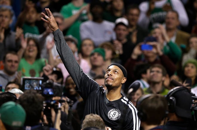 AP photo

Brooklyn Nets forward Paul Pierce, center, formerly of the Boston Celtics, waves to the crowd during a tribute to him before Sunday's game in Boston.