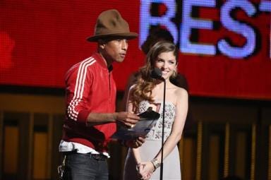 Pharrell Williams, left, and Anna Kendrick present the award for best new artist at the 56th annual Grammy Awards at Staples Center on Sunday in Los Angeles.