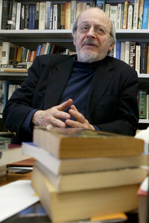 Author E.L. Doctorow smiles during an interview in his office at New York University. Doctorow's latest book, "Andrew's Brain," takes on the ongoing debates about science vs. literature and humans vs. machines. The Associated Press