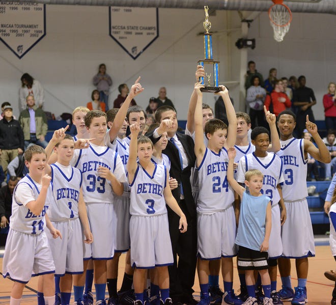 Bethel Christian Academy celebrates their tournament championship after a hard-fought victory over Contentnea Savannah on Saturday.