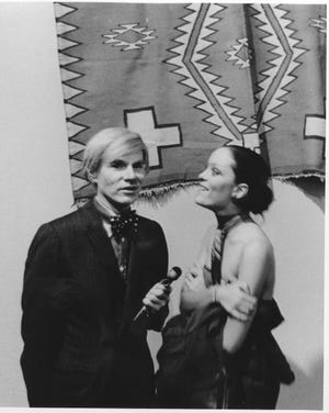 Andy Warhol, with supermodel Jane Forth, at the opening of his "Raid the Icebox" exhibit at RISD Museum in 1970.